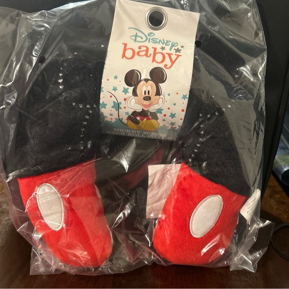 Mickey and Minnie Mouse travel neck pillows.